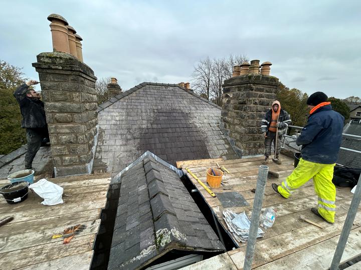 MCG team re-pointing two gritstone chimney stacks and applying masonry cream