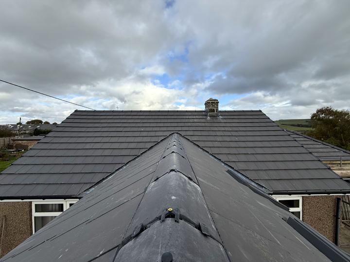 New grey tiled roof with dry ridge and hips