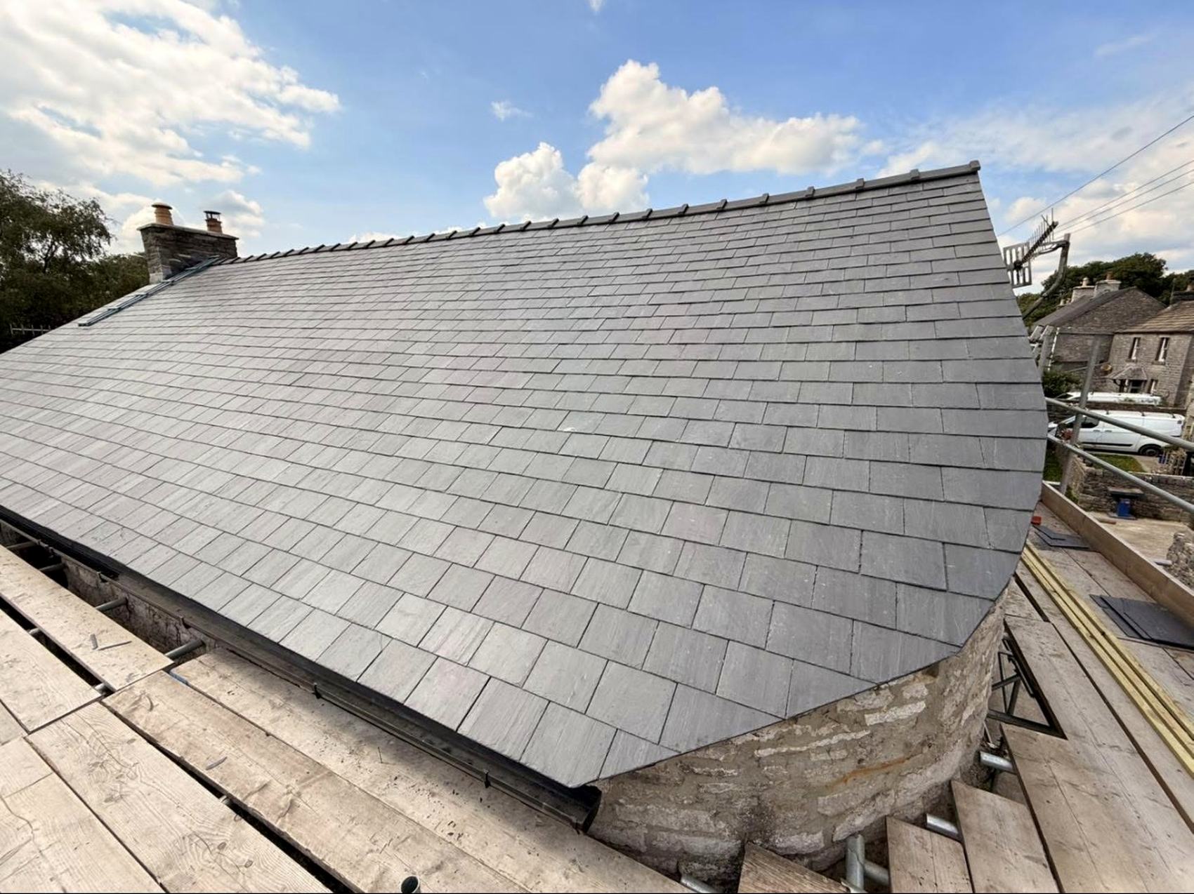 Heritage natural slate re-roof with Velux windows on a Derbyshire gritstone property